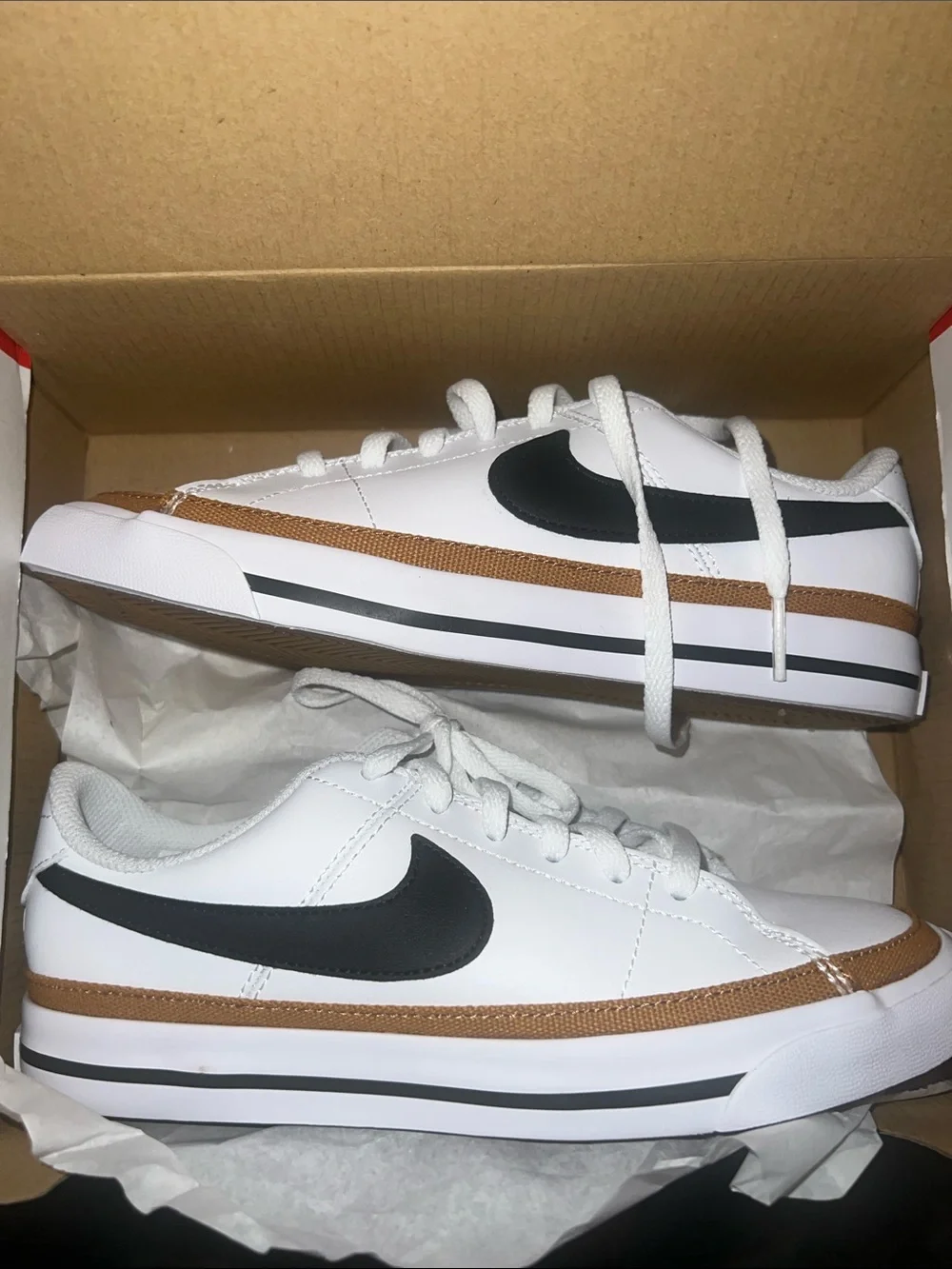 Nike Kids White Sneakers with Black Swoosh and Brown Trim